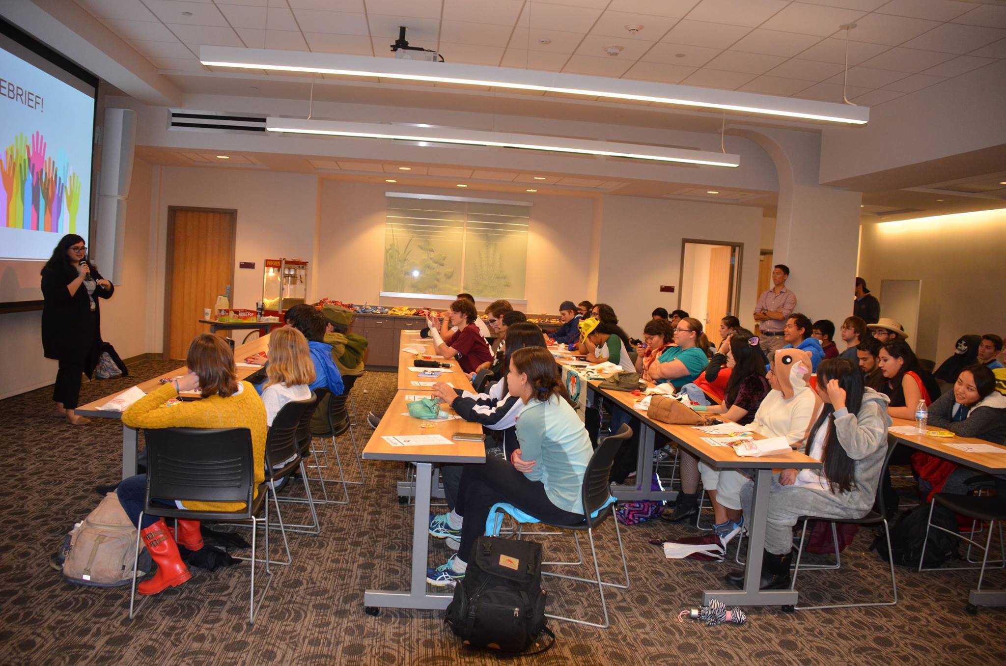 Attendees engage in a Halloween-themed General Assembly